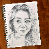 A sketch of a woman in a notebook.
